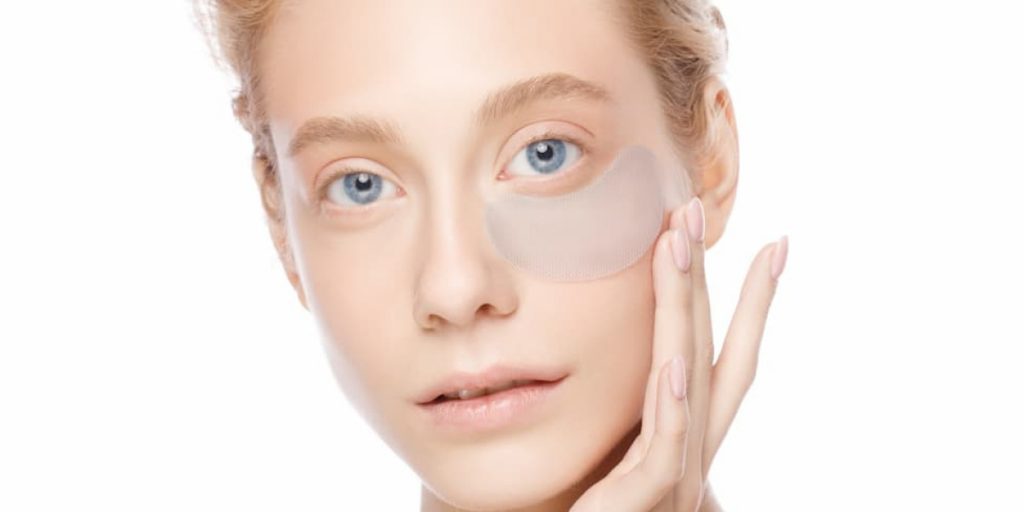 woman is masking her eye bags