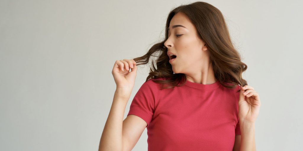 woman touching her curls