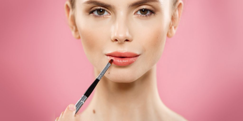 woman augmented lips with cosmetic products