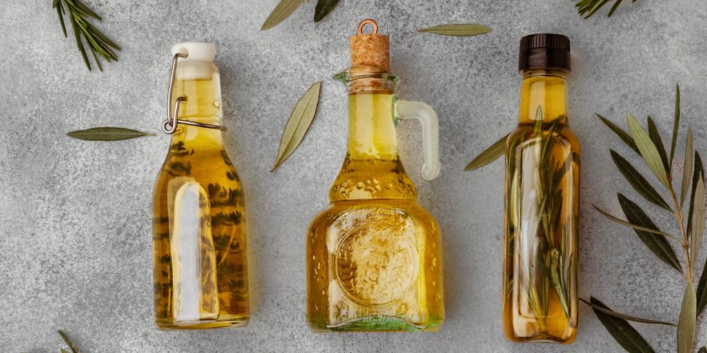 3 olive oil bottles on the table