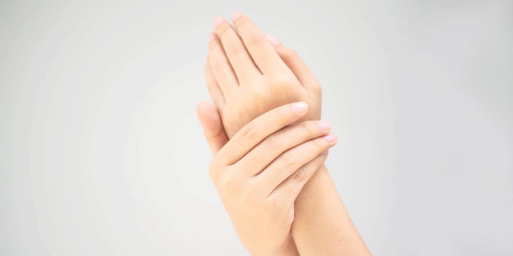 moisturized woman hands closeup