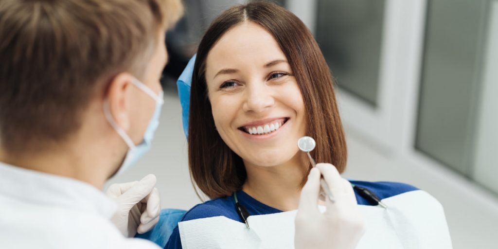 girl is smiling at dentist's