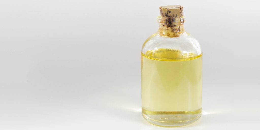 castor oil jar on white background