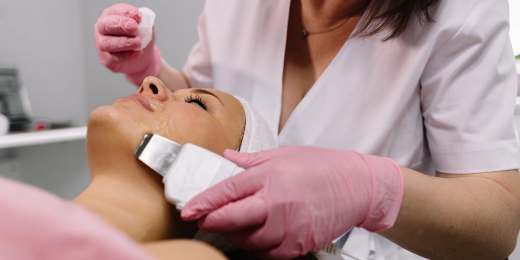 a girl is taking cosmetological procedure