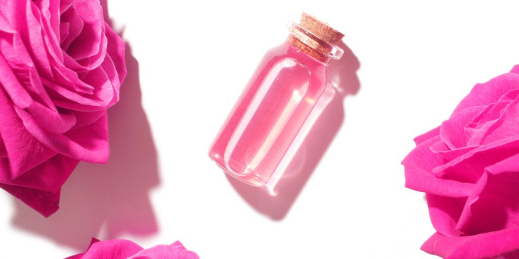 a small bottle with pink liquid