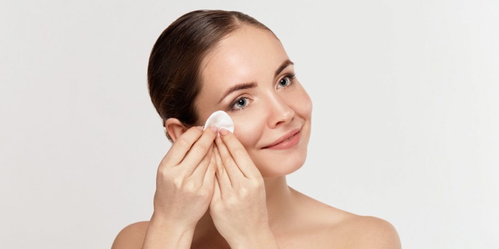 removing makeup with cotton pads