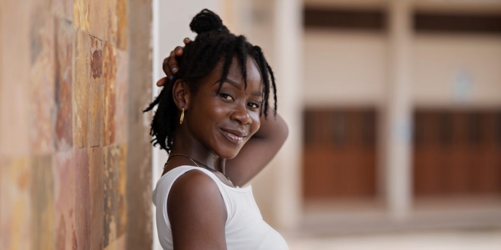 smiling woman with dreads
