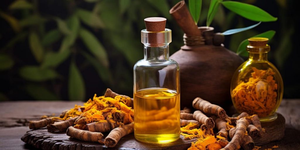 Turmeric oil bottles with roots and leaves